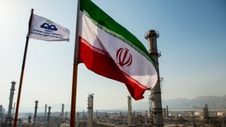 The Iranian flag above the new Phase 3 facility at the Persian Gulf Star gas condensate refinery in Bandar Abbas, Iran, in 2019.