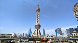 SHANGHAI, CHINA – MARCH 7, 2023 – The Oriental Pearl Tower, Shanghai Tower, Jinmao Tower and World Financial Center are seen on Lujiazui Street, Shanghai, China, March 7, 2023.