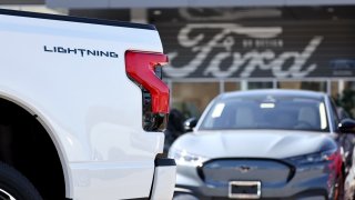 A Ford F-150 Lightning electric pickup truck is displayed for sale at a Ford dealership on August 21, 2024 in Glendale, California. 