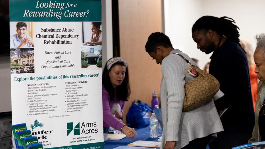 Jobseekers talk to a recruiter at the Albany Job Fair in Latham, New York, US, on Wednesday, Oct. 2, 2024. 