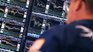 Traders work on the floor of the New York Stock Exchange during afternoon trading on October 03, 2024 in New York City. 