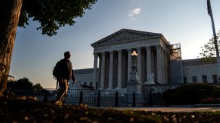 People pass outside the U.S. Supreme Court on October 7, 2024 in Washington, DC. 