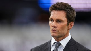 Tom Brady looks on prior to an NFL football game between the Baltimore Ravens and the Dallas Cowboys at AT&T Stadium on September 22, 2024 in Arlington, Texas. (Photo by Cooper Neill/Getty Images)