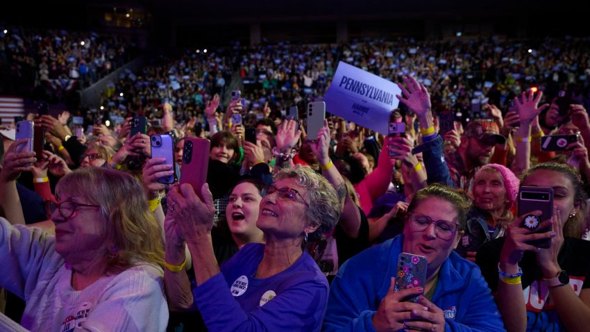 Supporters cheers as US Vice President and Democratic presidential candidate Kamala Harris arrives to speak at a campaign event at the Erie Insurance Arena in Erie, Pennsylvania, on October 14, 2024. 