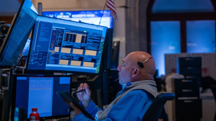 NEW YORK, NEW YORK – OCTOBER 16: Traders and others work on the New York Stock Exchange (NYSE) floor in New York City. 