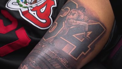 Dodger fans show their loyalty to the team with tattoos