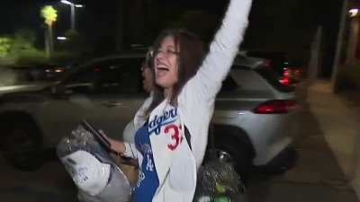 Dodger fans celebrate first win against the Yankees in World Series