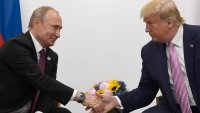 FILE – In this June 28, 2019, file photo President Donald Trump, right, shakes hands with Russian President Vladimir Putin, left, during a bilateral meeting on the sidelines of the G-20 summit in Osaka, Japan. For the past three years, the administration has careered between President Donald Trump’s attempts to curry favor and friendship with Vladimir Putin and longstanding deep-seated concerns about Putin’s intentions.