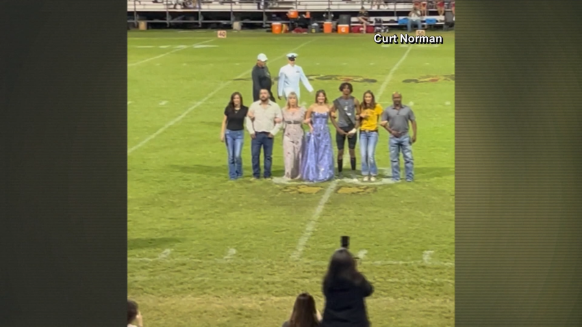 Amerie Stidham and her family on football field