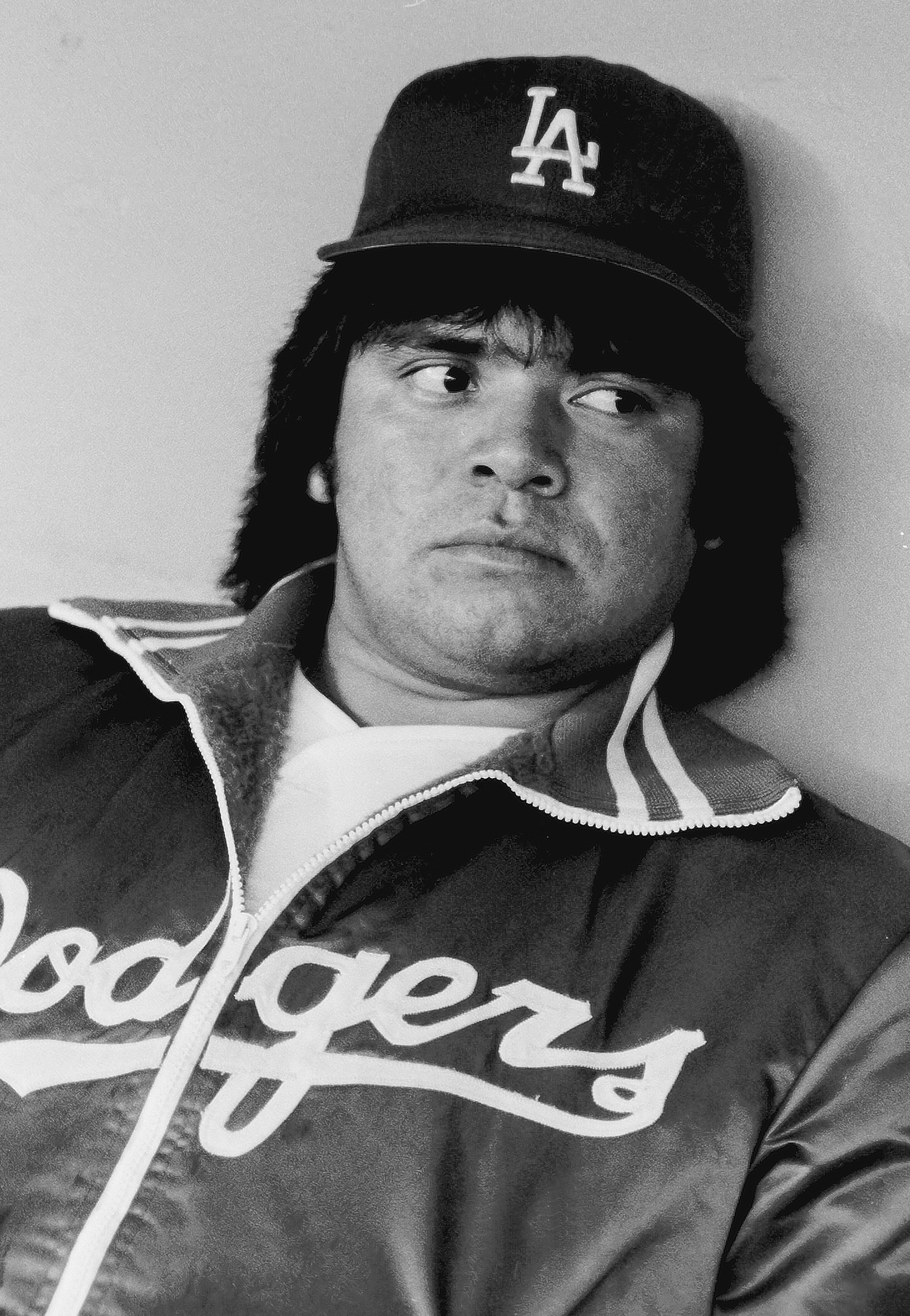 LOS ANGELES, CA – 1981:  Fernando Valenzuela #34 of the Los Angeles Dodgers sits in the dugout during a game at Dodger Stadium, Los Angeles, California. (Photo by Jayne Kamin-Oncea/Getty Images)