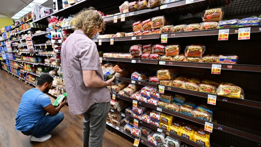 People shop for bread at a supermarket in Monterey Park, California on October 19, 2022. - Food prices in September rose 13% over last year, according to data released by the US government, as inflation raises prices to its highest levels in decades. (Photo by Frederic J. BROWN / AFP) (Photo by FREDERIC J. BROWN/AFP via Getty Images)