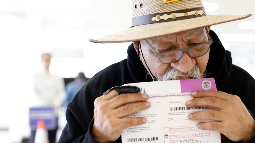 NORWALK-CA-MARCH 4, 2024: Francisco Salomon Mendoza, 72, of La Puente, seals his mail-in ballot at the Los Angeles County Registrar Recorder in Norwalk on March 4, 2024. (Christina House / Los Angeles Times via Getty Images)