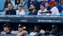 LOS ANGELES, CALIFORNIA - OCTOBER 25: Billy Crudup, Jaseon Bateman and Flea watch during Game One of the 2024 World Series between the Los Angeles Dodgers and the New York Yankees at Dodger Stadium on October 25, 2024 in Los Angeles, California. (Photo by Kevork Djansezian/Getty Images)