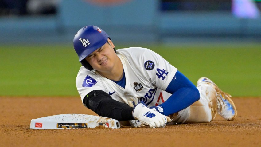 Oct 26, 2024; Los Angeles, California, USA; Los Angeles Dodgers designated hitter Shohei Ohtani (17) reacts at second base after an apparent injury in the seventh inning against the New York Yankees during game two of the 2024 MLB World Series at Dodger Stadium. Mandatory Credit: Jayne Kamin-Oncea-Imagn Images