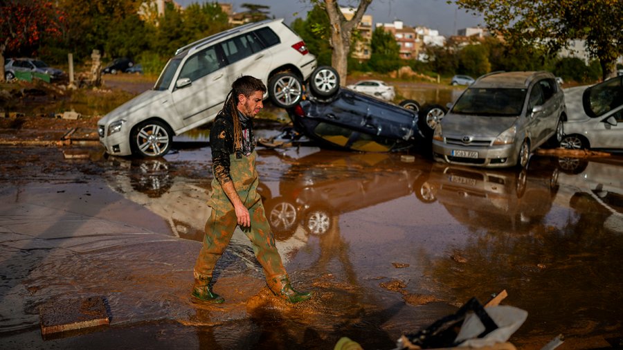 Flooded cars are piled up in Utiel, Spain, Wednesday, Oct. 30, 2024.