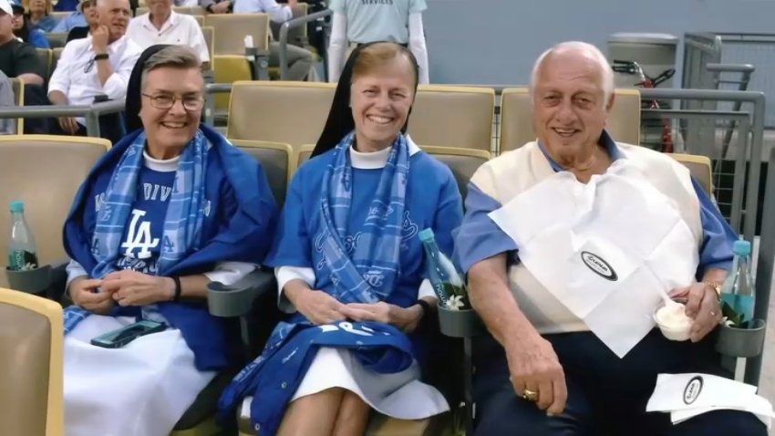 Sister Johnellen Turner and Sister Joann Ashburn at a Dodger game with Tommy Lasorda.