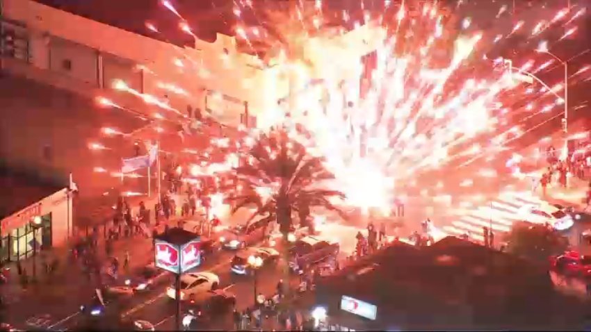 Dodger fans set off fireworks in East Los Angeles on Saturday, Oct. 26, 2024 in celebration of the team wining Game 2 of the 2024 World Series.