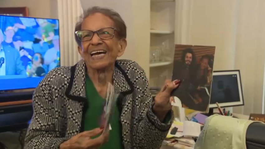 Andrea Perez, 93, displays family photos at her East Hollywood apartment.