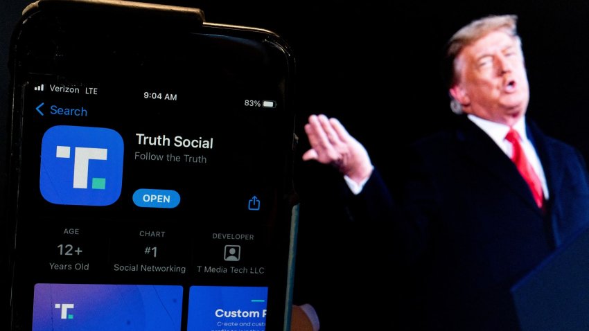 This photo illustration shows an image of former President Donald Trump next to a phone screen that is displaying the Truth Social app, in Washington, DC, on February 21, 2022.