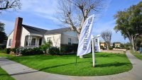 An “Open House” flag is seen in front of a home for sale in Alhambra, California, on Jan. 18, 2024.