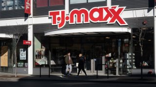 A sign hangs at the entrance of a T. J. Maxx store on February 28, 2024 in Chicago, Illinois. 