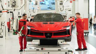 Workers on the production line at the new Ferrari NV E-building factory in Maranello, Italy, on Friday, June 21, 2024. 