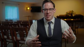 Victor M. Sweeney inside DuBore Funeral Home.