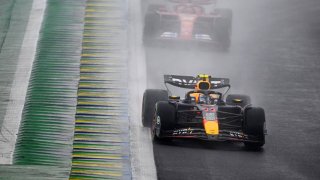 Sergio Perez of Mexico driving the (11) Oracle Red Bull Racing RB20 leads Carlos Sainz of Spain driving (55) the Ferrari SF-24 on track  during the F1 Grand Prix of Brazil at Autodromo Jose Carlos Pace on November 03, 2024 in Sao Paulo, Brazil.