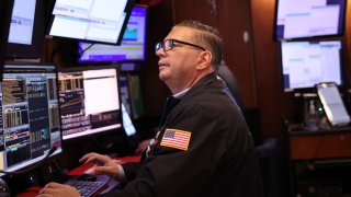 Traders work on the floor of the New York Stock Exchange during the morning trading on November 07, 2024 in New York City. 