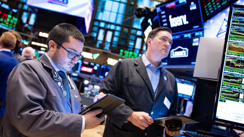 Traders work on the floor of the New York Stock Exchange. 