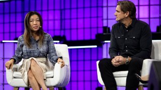 Edith Yeung, general partner at Race Capital, and Larry Aschebrook, founder and managing partner of G Squared, speak during a CNBC-moderated panel at Web Summit 2024 in Lisbon, Portugal.