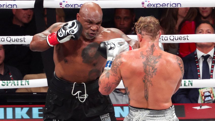 Mike Tyson (black gloves) fights Jake Paul (silver gloves) at AT&T Stadium in Arlington, Texas, on Nov. 15, 2024.
