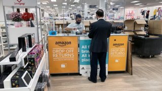 FILE – People return items purchased online at an Amazon counter inside a Kohl’s department store in Clifton, New Jersey, on Sept. 3, 2021.