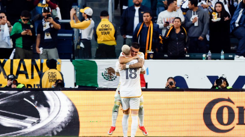 Los Angeles Galaxy’s Gabriel Pec, right, celebrates with teammate Marco Reus (18) after scoring during the second half of an MLS Semifinal Conference playoff soccer match against Minnesota United, Sunday, Nov. 24, 2024, in Los Angeles. (AP Photo/Etienne Laurent)