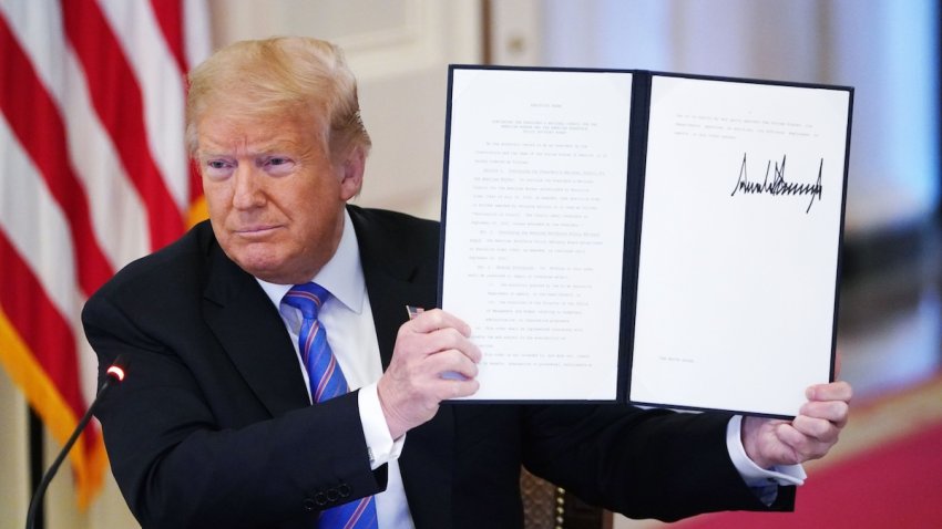 File – President Donald Trump holds an executive order on “Continuing the President’s National Council for the American Worker and the American Workforce Policy Advisory Board” which he signed in the East Room of the White House in Washington, DC on June 26, 2020.