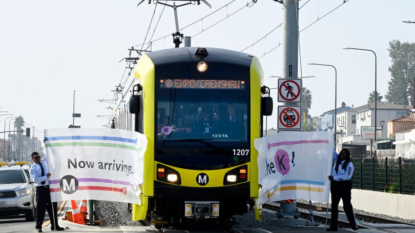 Los Angeles, CA - October 07: Breaking through a banner, the K Line or Crenshaw Line subway/light rail is officially open in Los Angeles on Friday, October 7, 2022. (Photo by Brittany Murray/MediaNews Group/Long Beach Press-Telegram via Getty Images)