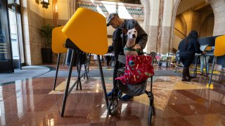 Los Angeles, CA – March 05: Voters cast their ballots inside the cavernous lobby of the Metro Headquarters Building on Tuesday, March 5, 2024 in Los Angeles, CA. (Brian van der Brug / Los Angeles Times via Getty Images)