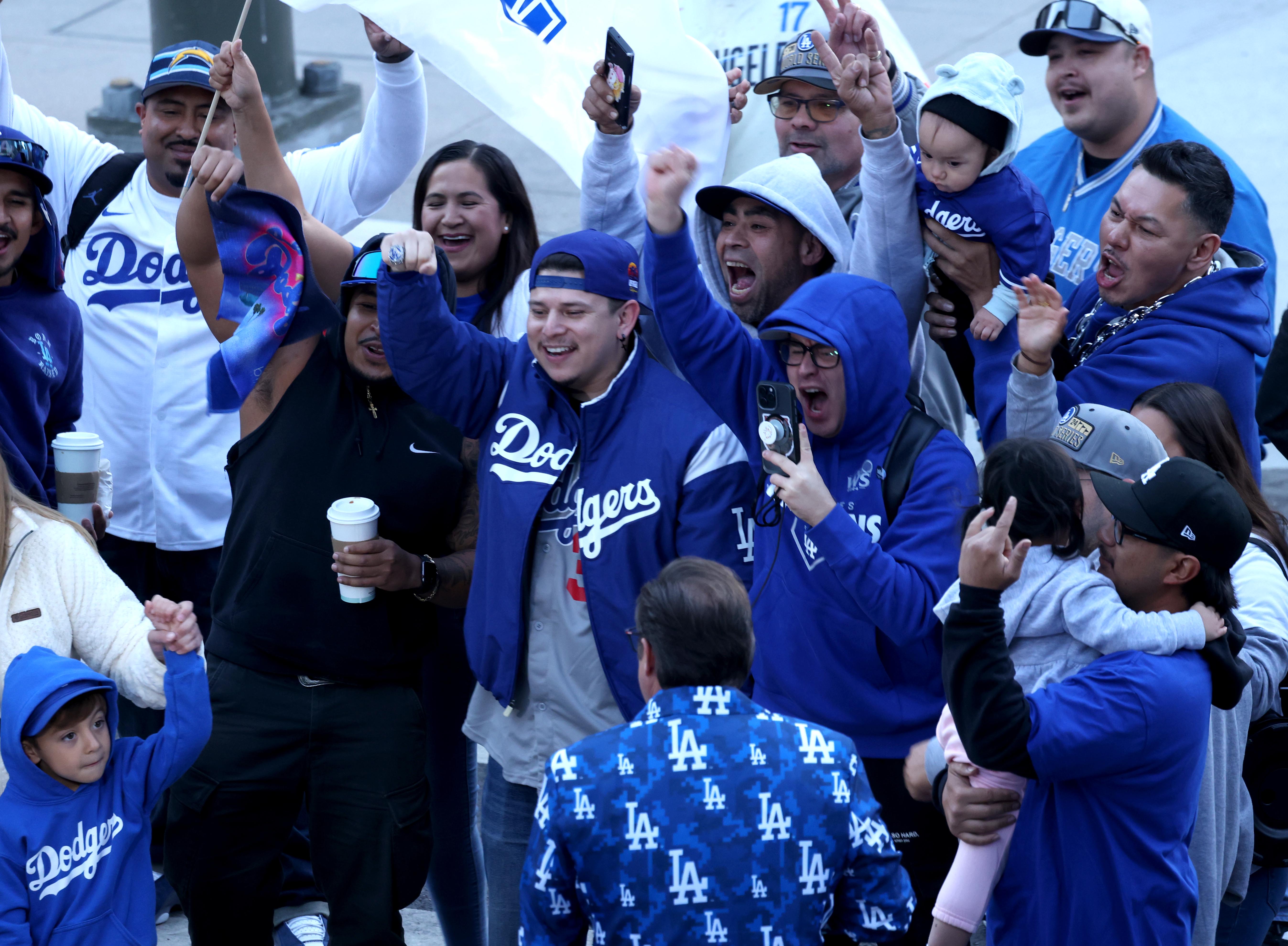 LOS ANGELES, CA – NOVEMBER 1, 2024 – – Fans get into the spirit in the early morning, hours before the Los Angeles Dodgers celebrate their World Series win traveling in a parade route along 5th Street in downtown Los Angeles on November 1, 2024. (Genaro Molina/Los Angeles Times via Getty Images)