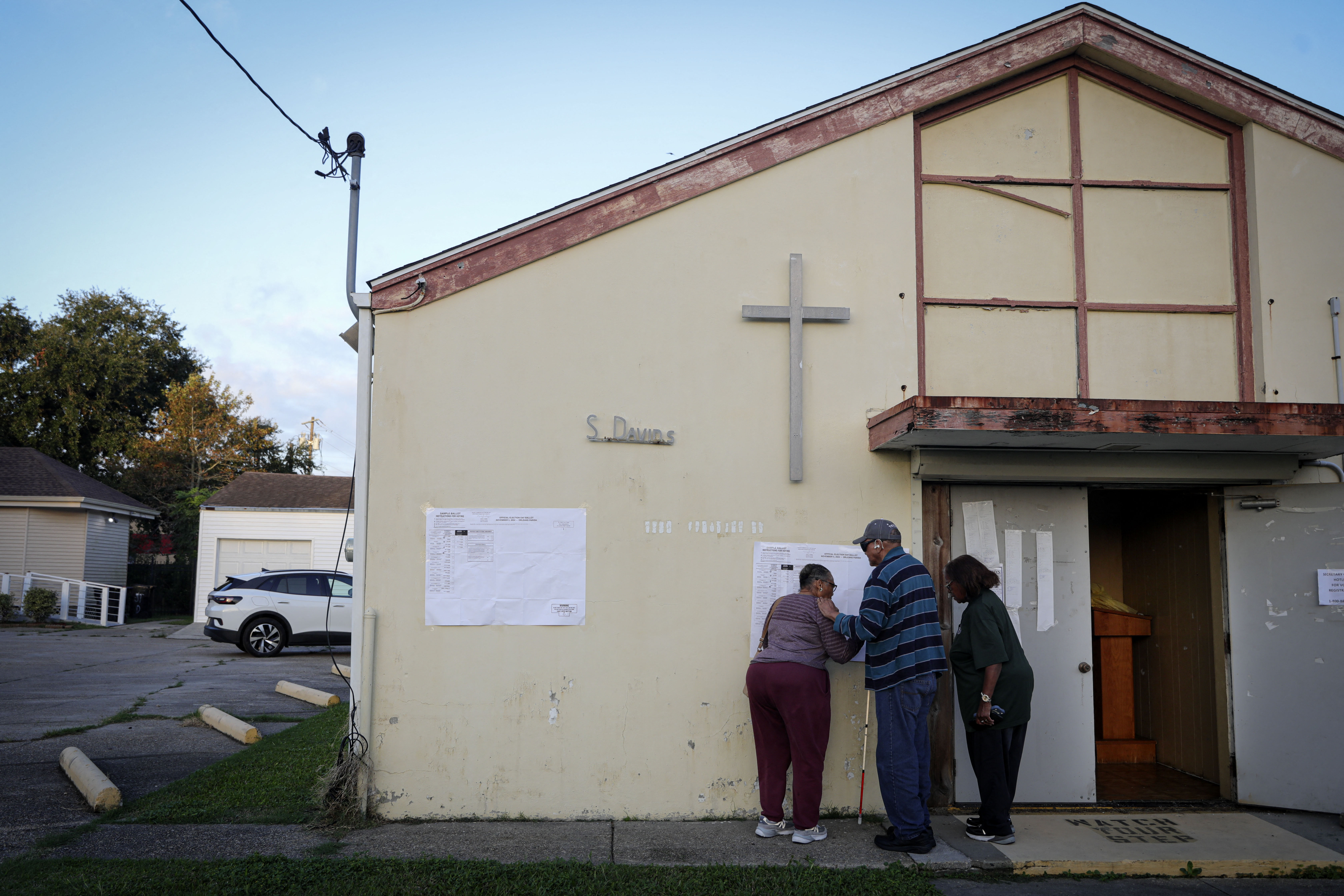 People arrive to vote at a polling station at St. David’s Baptist Church in the 9th Ward area of New Orleans, Louisiana, on Election Day, November 5, 2024.