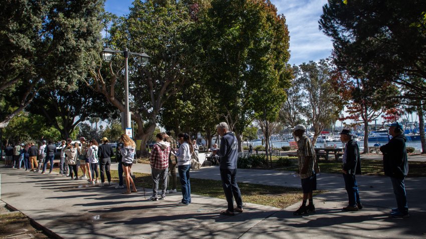 People stand in line to vote outside the Burton Chace Park-Marina Del Rey vote center on November 5, 2024 in Los Angeles.