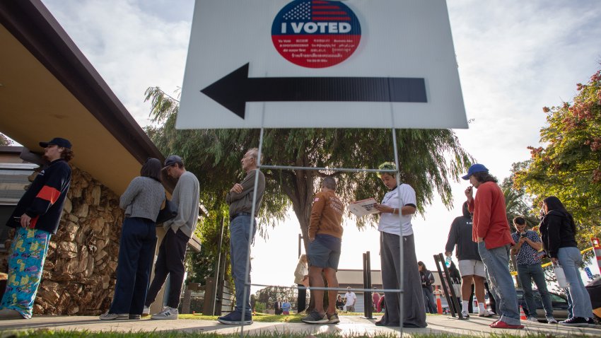 People stand in line to vote at Joslyn Park vote center on November 5, 2024 in Santa Monica.