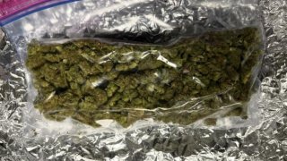 Marijuana in a plastic bag on aluminum foil