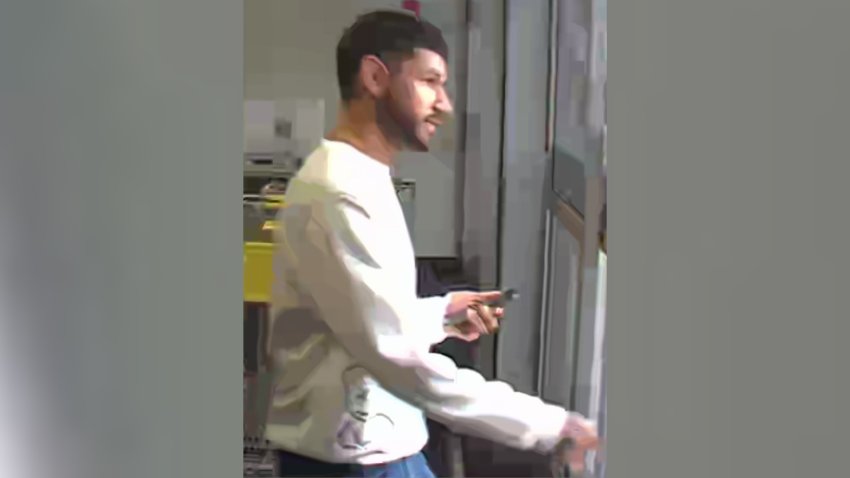 Police released a photo of the suspected serial phone thief targeting Trader Joe's customers. They said he is believed to be holding one of the stolen phones while he was at the Best Buy in Mira Mesa.