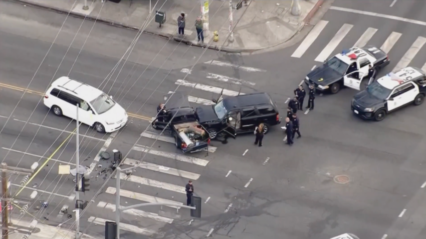 The suspect, driving the black SUV, crashed into the side of a pickup truck at the intersection of Florence Ave. and San Pedro St. in South Los Angeles.