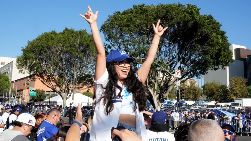 Fans arrive to support the Los Angeles Dodgers before the 2024 World Series championship parade.