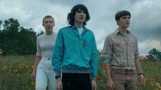 Millie Bobby Brown, Finn Wolfhard and Noah Schnapp in character while filming "Stranger Things."