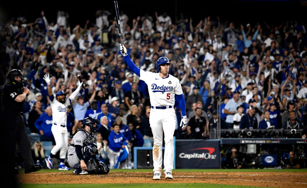 No. 1: Freddie Freeman channels Kirk Gibson with walk-off grand slam in Game 1 of World Series<br><br>It's rare when a singular moment supersedes a championship moment, but the 2024 World Series will always be remembered by Freddie Freeman's walk-off grand slam in Game 1 at Dodger Stadium. Freeman, who suffered a high-ankle sprain in the Dodgers final home game of the regular season, played through tremendous pain during the playoffs. Culminating in the moment of the year, Freeman channeled his inner Kirk Gibson when he stepped to the plate with the bases loaded, two outs and the Dodgers trailing 3-2 in the bottom of the 10th inning on October 25, 2024. With the Yankees one-out away from taking a 1-0 lead in the series, Freeman crushed a first-pitch fastball for a grand slam into the right field pavilion (almost the identical spot that Gibson hit his home run in Game 1 of the 1988 World Series). This moment, and the pandemonium that ensued afterwards, catapulted the Dodgers to their 8th World Series title in team history. (Photo by Keith Birmingham/MediaNews Group/Pasadena Star-News via Getty Images)