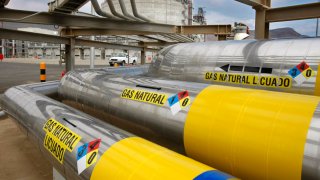 A network of insulated pipes carry liquefied natural gas from ships to giant storage tanks at Sempra Energy’s Costa Azul terminal north of Ensenada, Mexico.