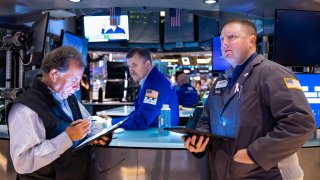 Traders work on the floor of the New York Stock Exchange on Nov. 22, 2024.