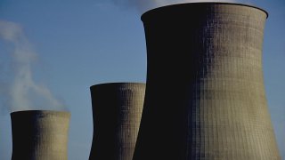 These are the iconic cooling towers of a nuclear power plant. these oversized smoke stacks vent steam form the Power plant These were shot in Winfield, West Virginia, USA.